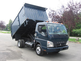 Navy blue Fuso semi truck and trailer